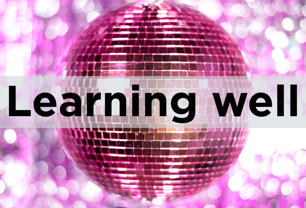 Pink glitter ball with text that reads learning well