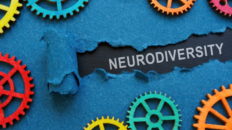 Neurodiversity word on scrap paper with cogs.