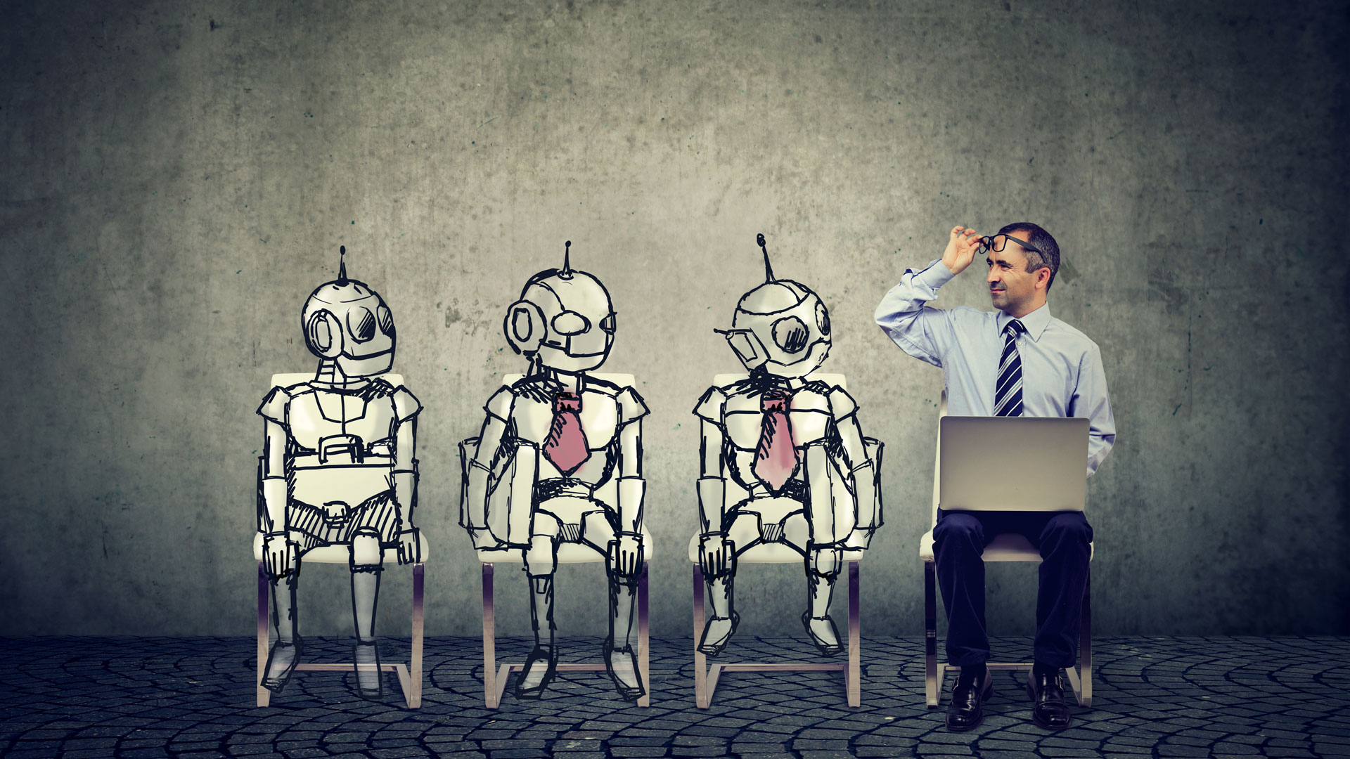 Three artistically drawn robots sitting next to an office man with a laptop