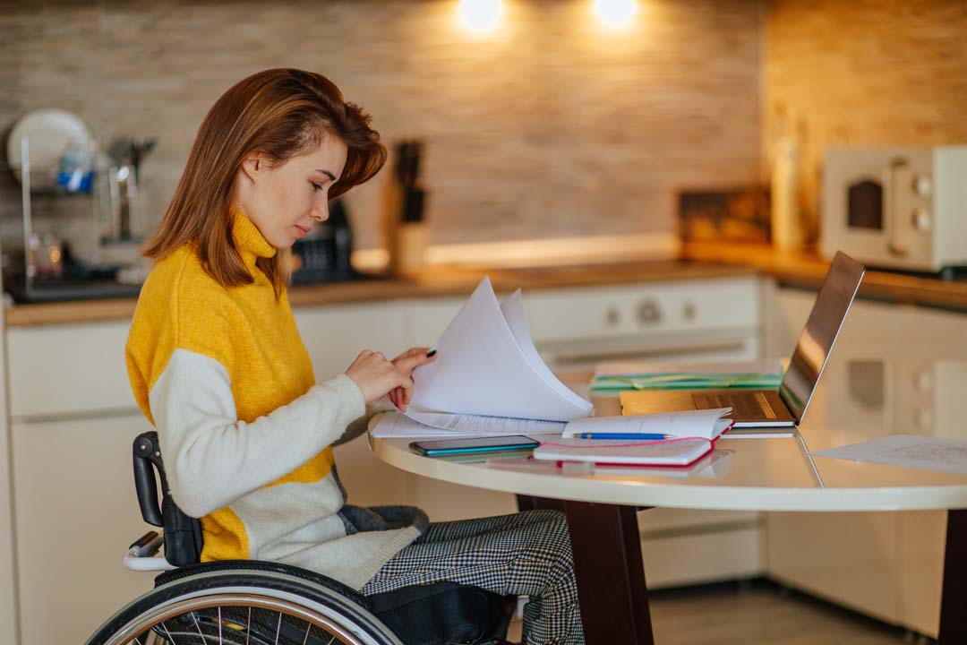 Woman in wheelchair studying