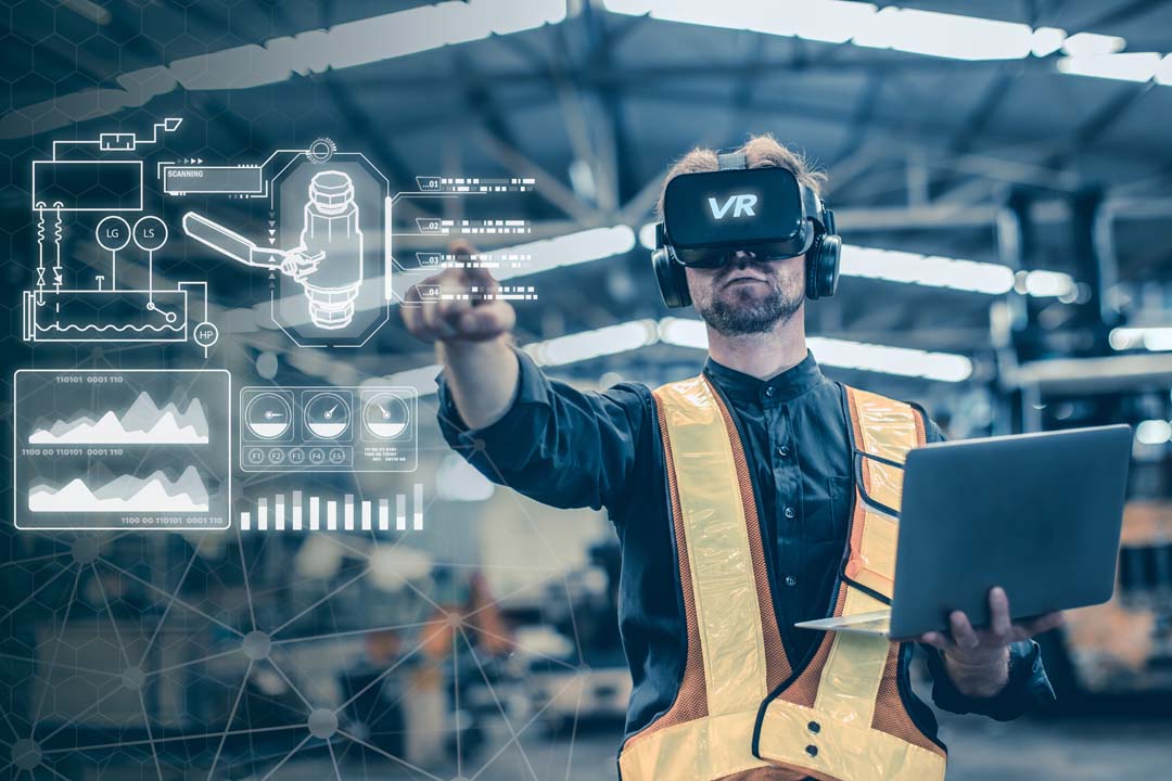 Engineer male using VR virtual reality technology in modern warehouse factory