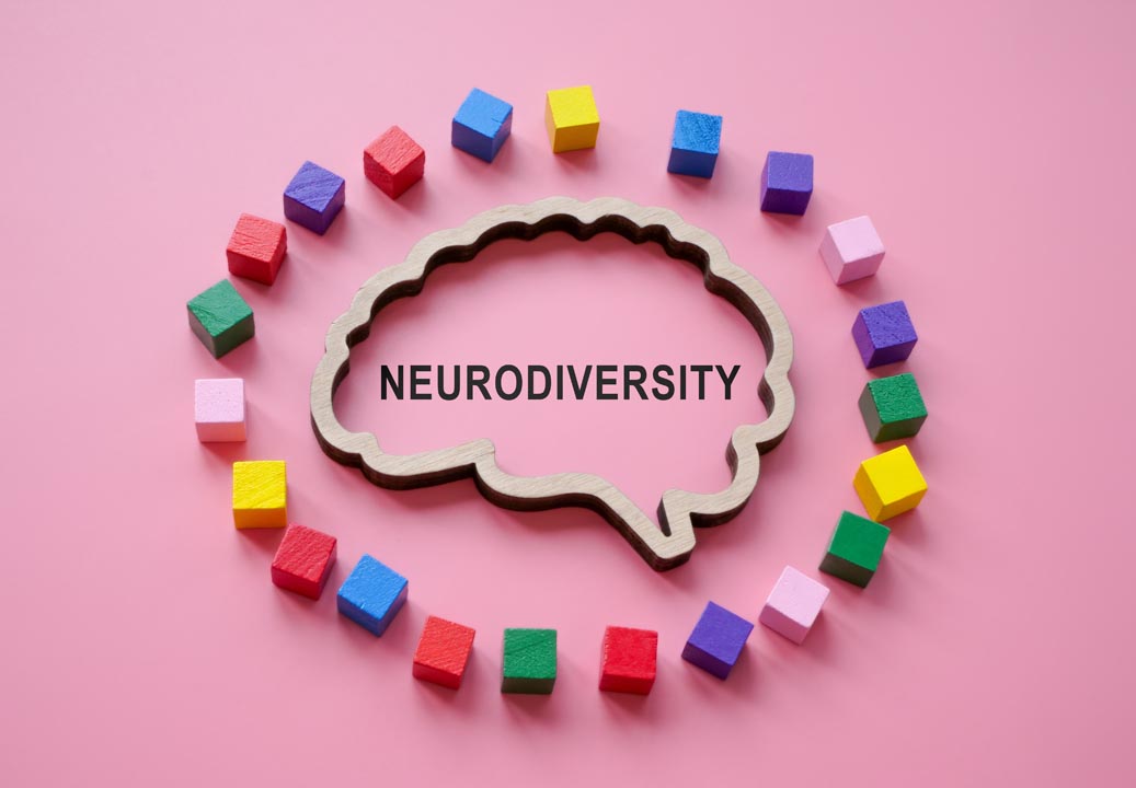The outline of the brain with the inscription neurodiversity is surrounded by coloured cubes.
