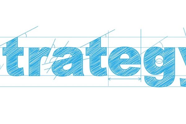 "STRATEGY" written in the style of a blue print design.