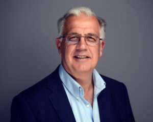 Paul Matthews, white male in a suit