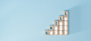 skills icon on wooden cube. Upskilling and personal development concept. Skill training, education, learning, ability. Upskilling, reskilling,