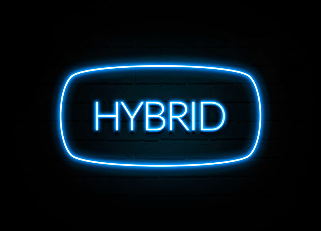 Hybrid  - colorful Neon Sign on brickwall