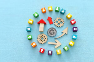 image of colorful blocks with people icons over wooden table ,human resources and management concept