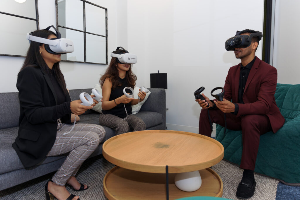 Three people at work using using virtual reality technology. (C) VR Vision
