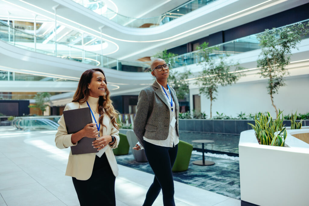 Professional coworkers walking in a modern law firm office building