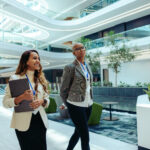 Professional coworkers walking in a modern law firm office building