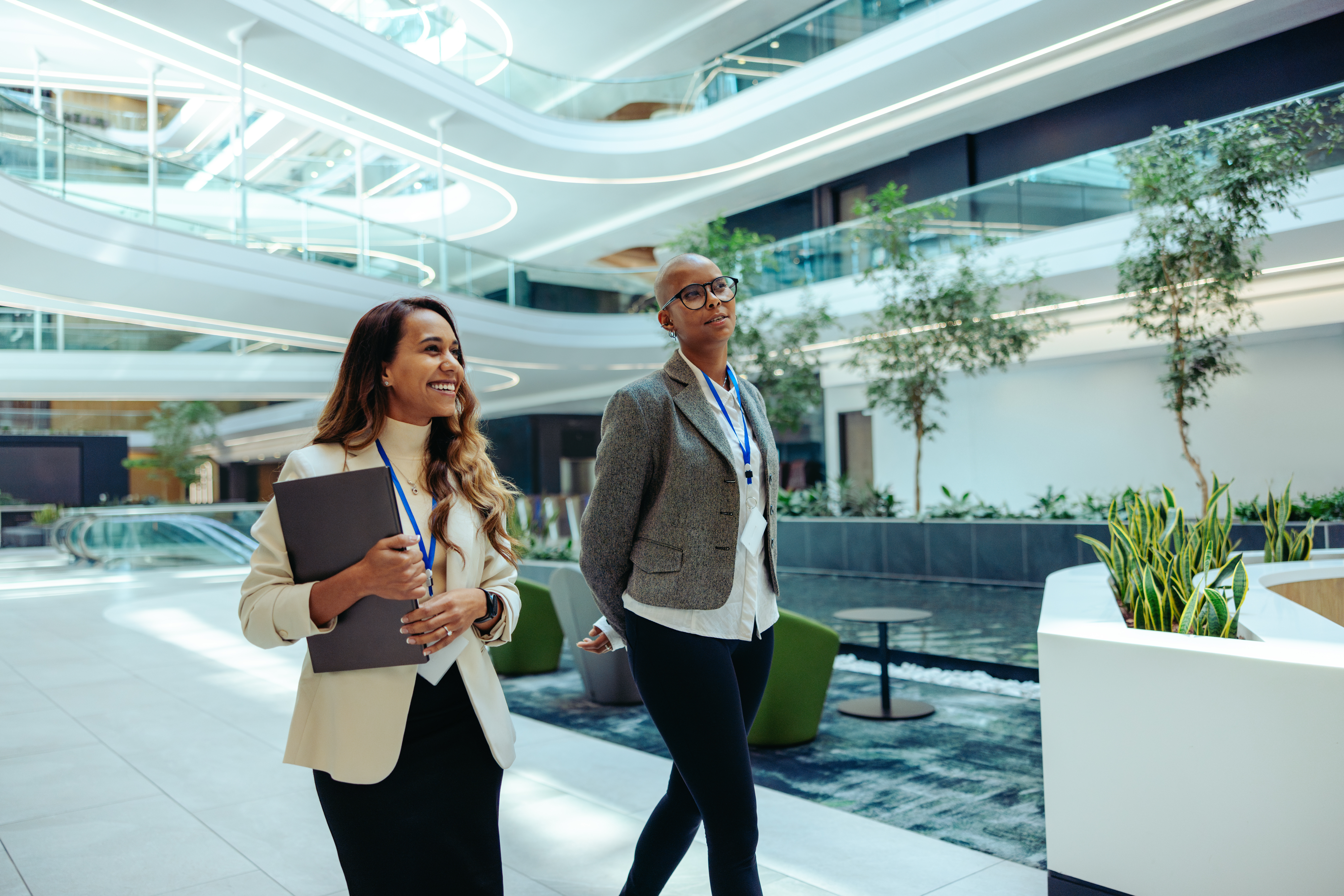 Professional coworkers walking in a modern law firm office building