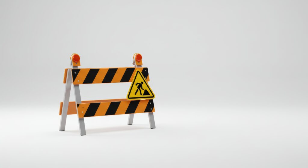Construction barrier on a clean white background, under construction safety concept