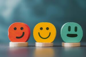 Customer service evaluation with colorful smiley faces representing feedback in a vibrant setting during a business review session