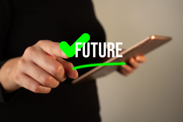 Woman holding a tablet while pointing at a button with a green check mark with the word future