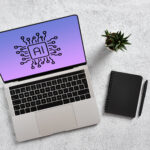 Laptop displaying artificial intelligence chipset on screen with notebook and pen on desk