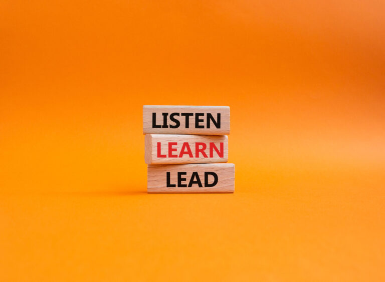 Listen Learn Lead symbol. Concept words Listen Learn Lead on wooden blocks. Beautiful orange background. Business and Listen Learn Lead concept. Copy space.