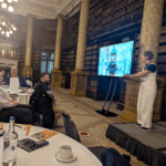 Business of Training Conference 2025 showing Stella Collins speaking on stage.