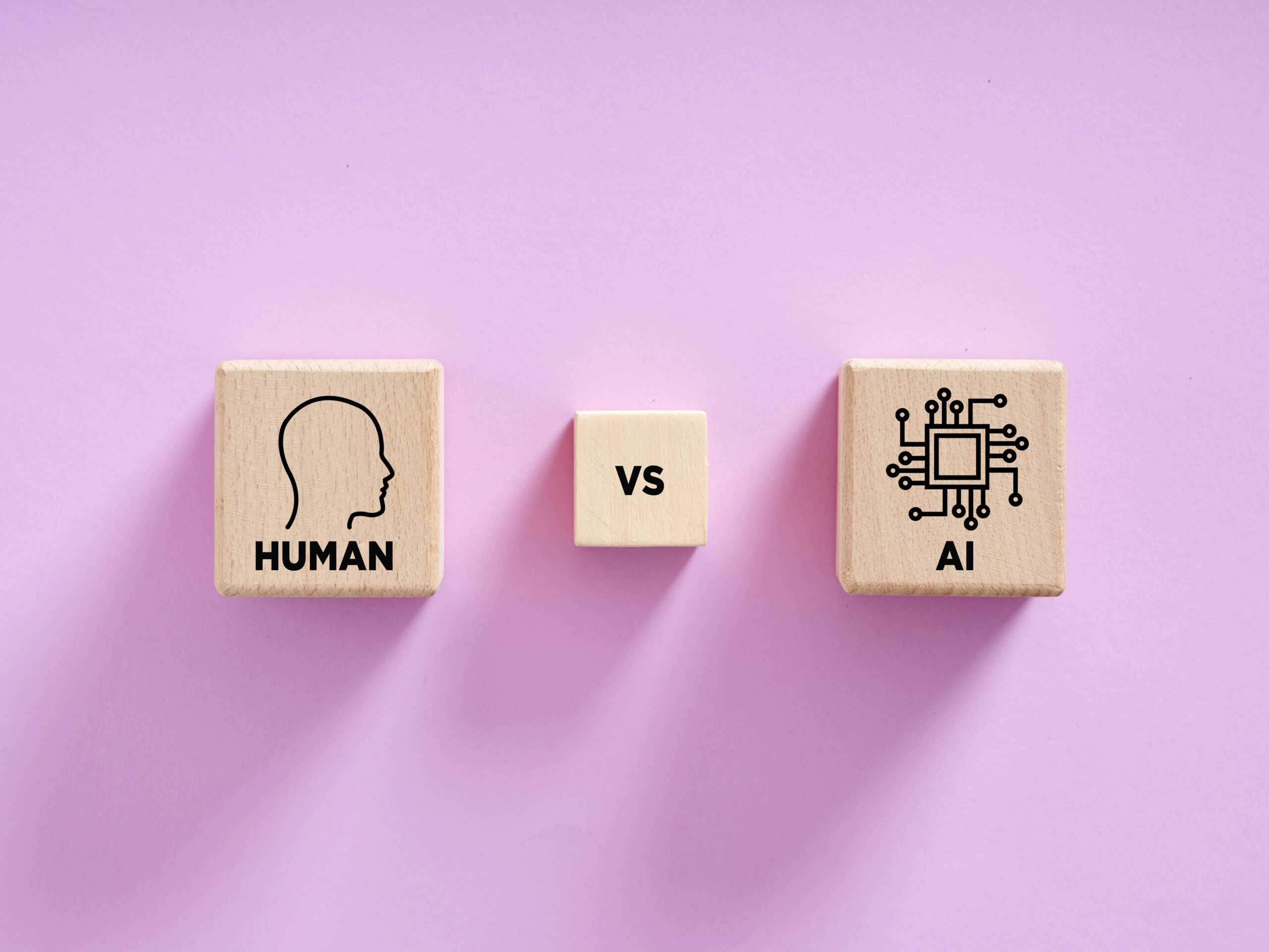 Human versus artificial intelligence concept comparing wooden cubes on purple background