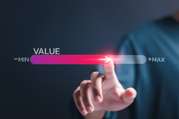 Person touch virtual screen of progress bar with the word VALUE for growth value, increase value, value added and business growth concept.