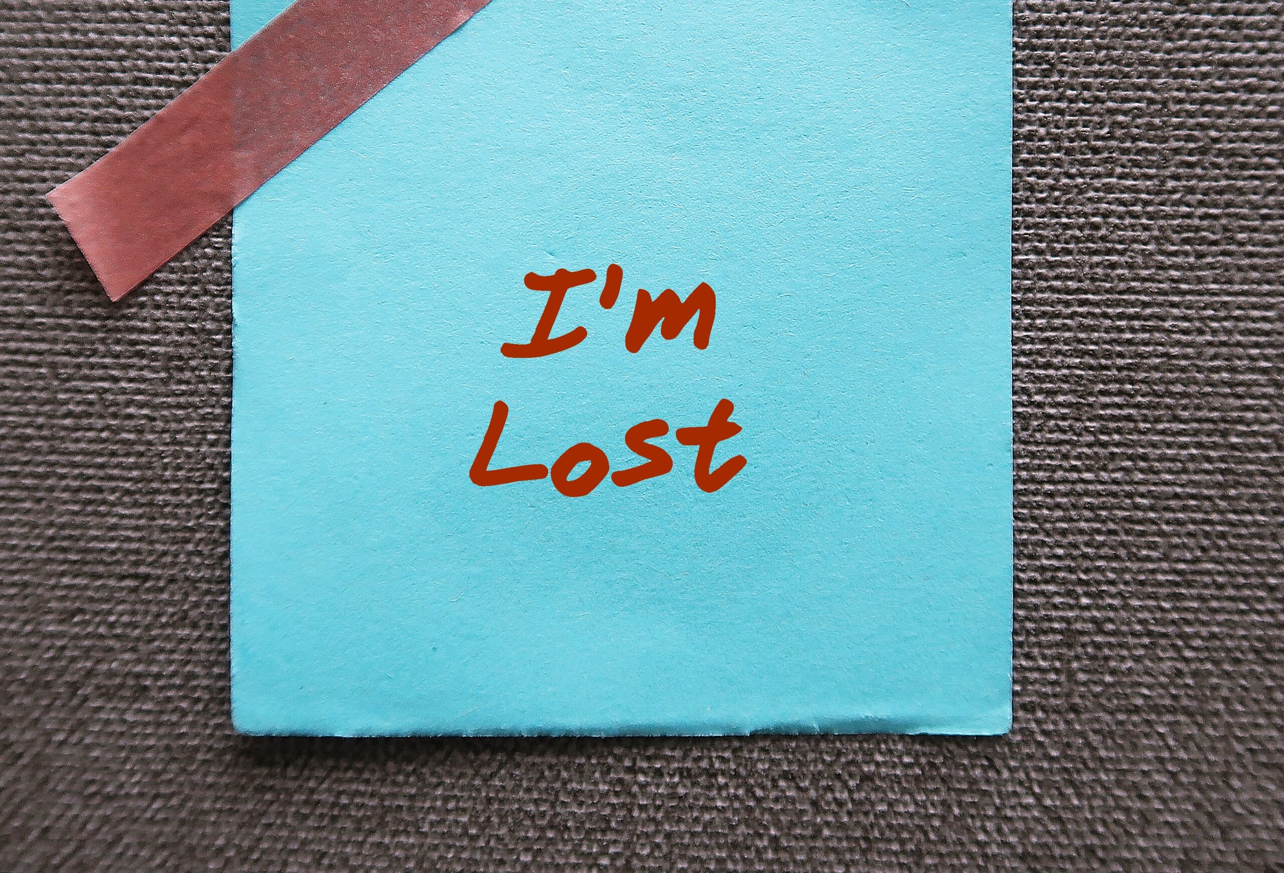Blue paper note written - I'm Lost - emotionally or mentally confused and don't know what to do - feeling overwhelmed, confused, uncertain how to proceed in life