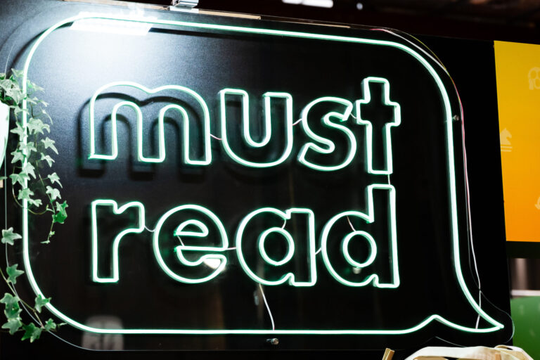 illuminated must read neon sign