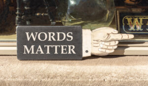 Words matter symbol. Concept word Words matter on beautiful black wooden hand with finger. Beautiful shop display background. Business words matter concept. Copy space.
