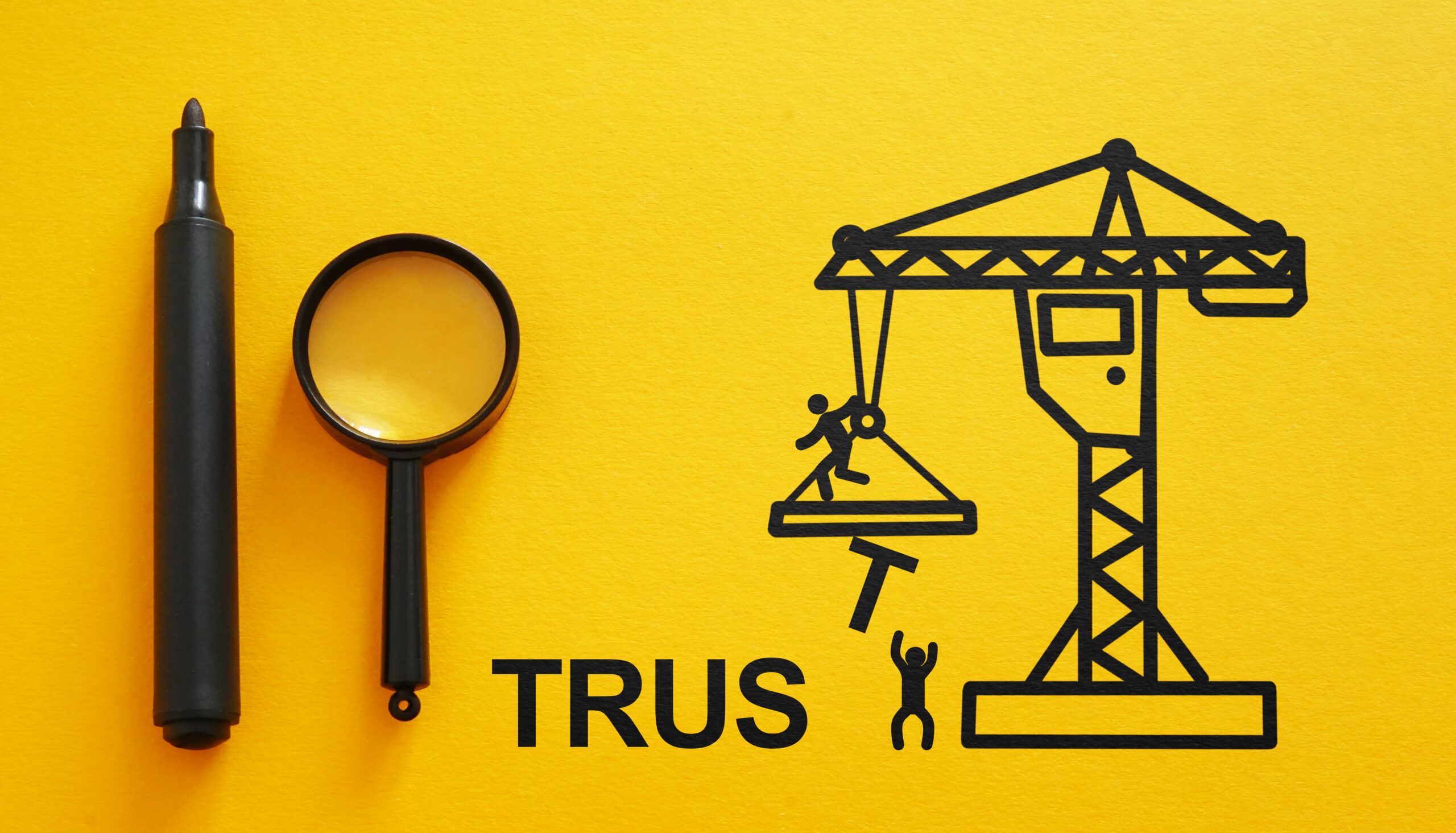 Build trust in business concept. Building a structure of blocks as the word TRUST