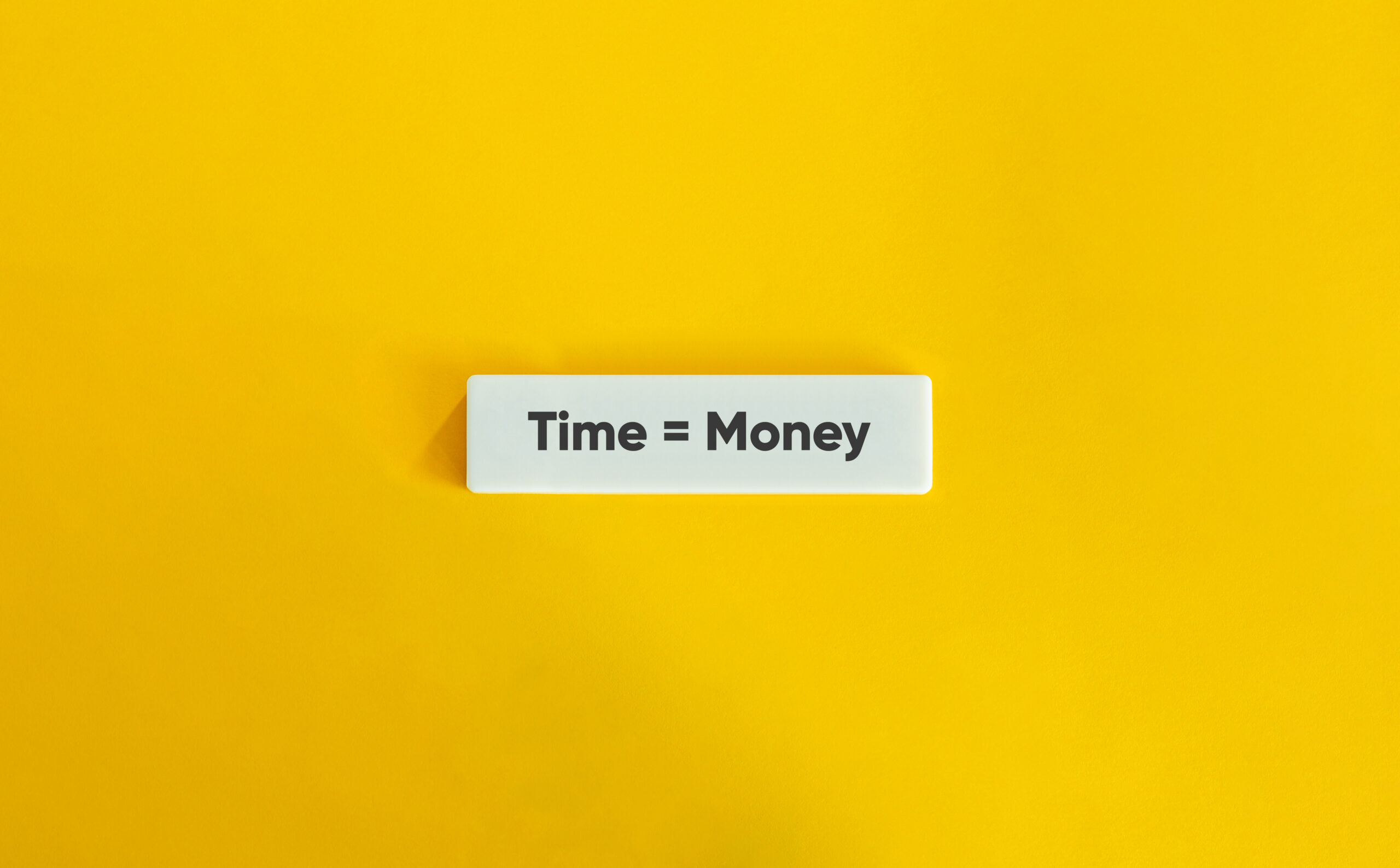 Time Equals Money Letter Tile on Yellow Background – Minimalist Concept of Productivity and Value