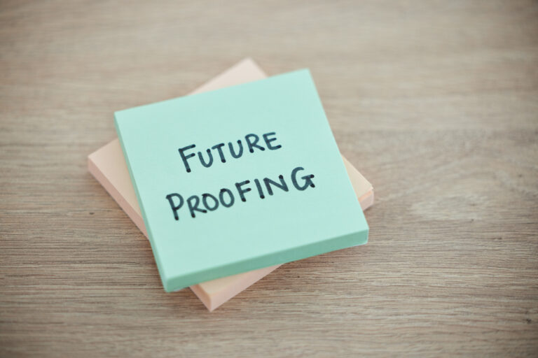 Sticky note, planning and schedule or desk text for writing or business growth ready for change. Post it or future proofing in leadership, creative innovation or new startup for company improvement