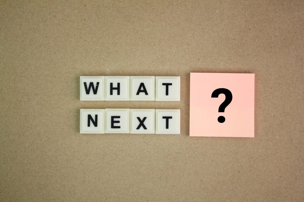 alphabet letter with the word question What's Next? next step concept