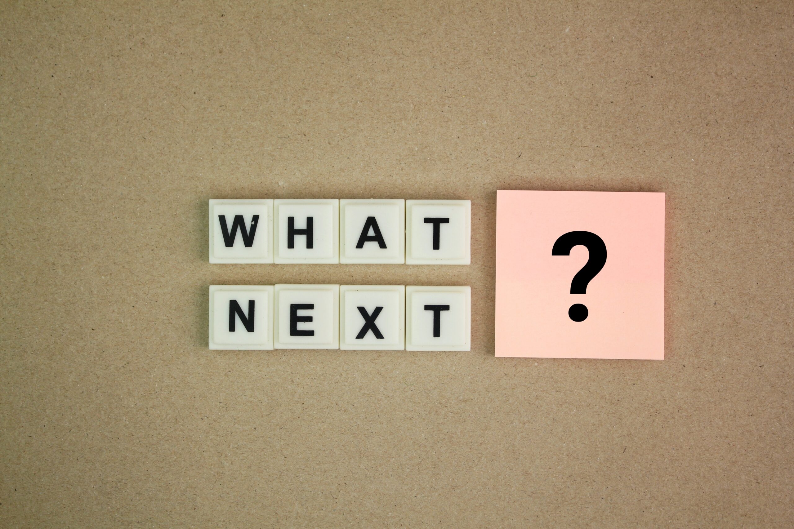alphabet letter with the word question What's Next? next step concept