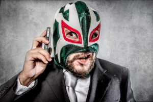 Trouble, aggressive executive suit and tie, Mexican wrestler mas