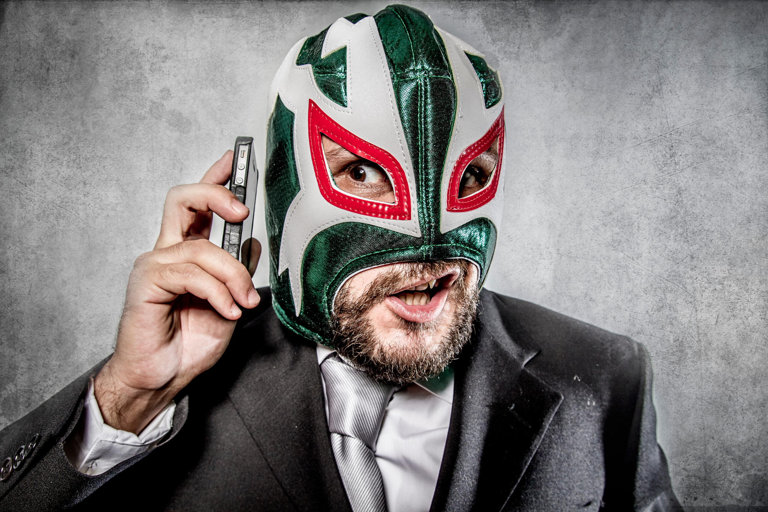 Trouble, aggressive executive suit and tie, Mexican wrestler mas