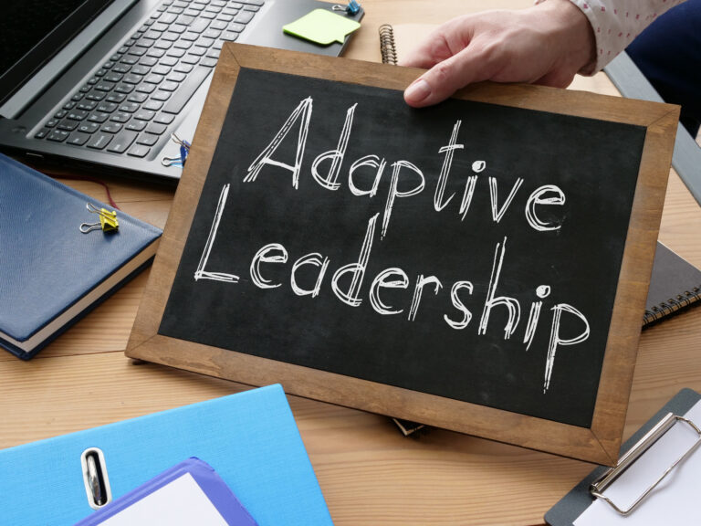 Adaptive Leadership is shown on the conceptual business photo