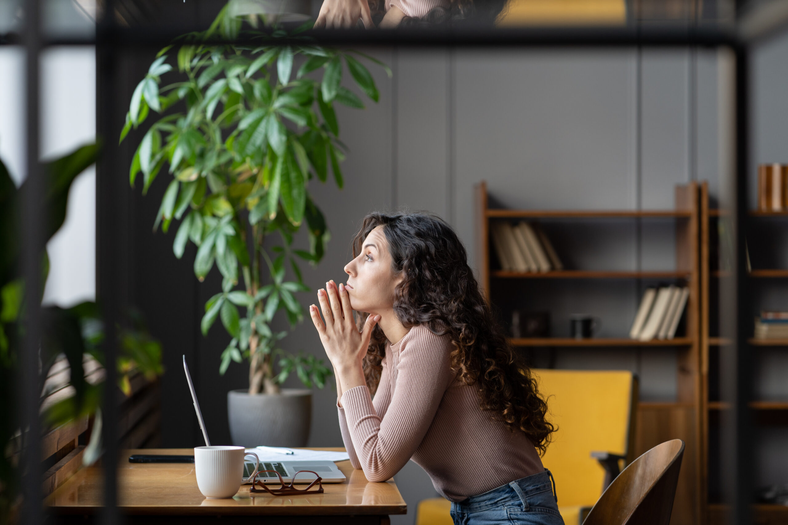 Bored unmotivated female worker sit at office desk with laptop tired of looking for problem solution, businesswoman need inspiration to make monotonous work or uninteresting task. Lack of motivation