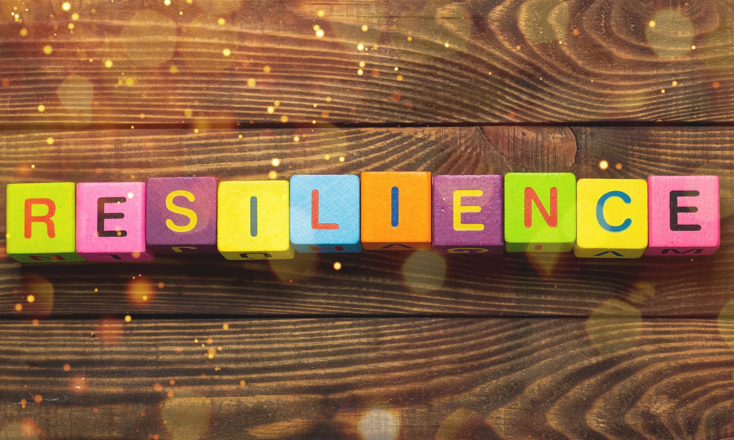 Resilience sign with wooden cubes on background